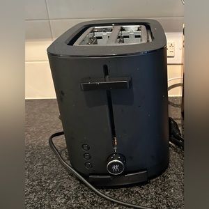This is a Zwilling matte black 2 short slots toaster with 3 automatic programmes